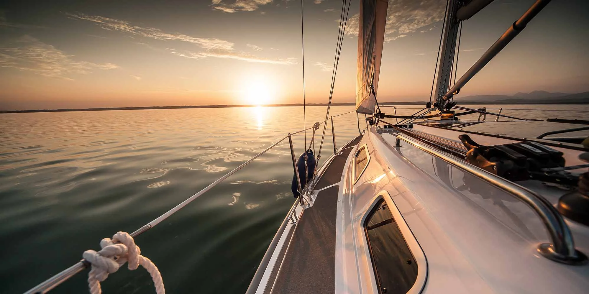 Working boats moored at a New England harbor, the kind of operation JT Kruk Associates advises